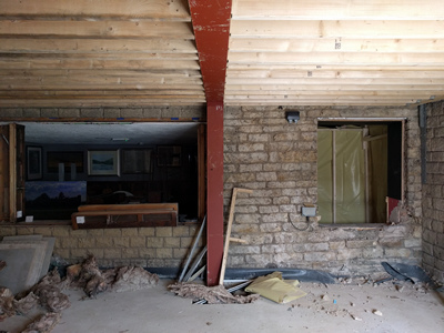 Int. Day. Pub. The removal of the existing, formerly exterior, windows thereby creating access into the newly built room.