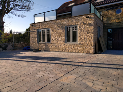 Ext. Day. Pub. Setts laid to the frontage of the building completed.