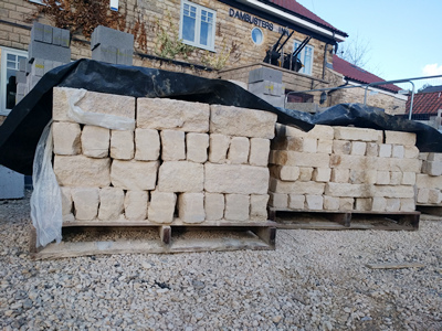 Ext.Day. Pub. Still on the delivery pallets, Natural Stone for the walls.